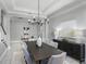 Elegant dining room with modern chandelier, neutral color scheme, and ample space for seating, perfect for hosting dinner parties at 1377 Tappie Toorie Cir, Lake Mary, FL 32746