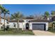 Inviting single-Gathering home with tile roof, well-maintained lawn, and a gray two-car garage at 1377 Tappie Toorie Cir, Lake Mary, FL 32746