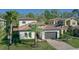 Beautiful home with a tile roof, manicured landscaping, and attached two-car garage at 1377 Tappie Toorie Cir, Lake Mary, FL 32746