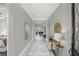 Inviting hallway with elegant decor, leading to the main living areas, offering a glimpse of the home's open and airy layout at 1377 Tappie Toorie Cir, Lake Mary, FL 32746