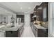 Modern kitchen featuring stainless steel appliances and granite countertops at 1377 Tappie Toorie Cir, Lake Mary, FL 32746