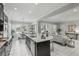 Bright and airy kitchen with island seating flows to dining and living areas, ideal for entertaining and Gathering gatherings at 1377 Tappie Toorie Cir, Lake Mary, FL 32746