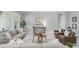 Inviting living room with stylish furniture, large windows, and modern decor at 1377 Tappie Toorie Cir, Lake Mary, FL 32746