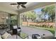 Covered patio with ample seating and a view of the manicured landscaping at 1377 Tappie Toorie Cir, Lake Mary, FL 32746