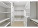 Walk-in closet with custom shelving and drawers at 1377 Tappie Toorie Cir, Lake Mary, FL 32746