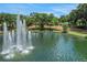 Scenic water feature with multiple fountains surrounded by lush greenery and trees, creating a peaceful park-like setting at 1377 Tappie Toorie Cir, Lake Mary, FL 32746