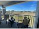 Relaxing balcony with seating and serene views at 13827 Fairway Island Dr # 1232, Orlando, FL 32837