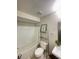 Cozy bathroom with white tiled shower and bath combination, toilet, and vanity with cabinet at 13827 Fairway Island Dr # 1232, Orlando, FL 32837