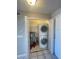 Convenient laundry closet featuring a stacked washer and dryer unit at 13827 Fairway Island Dr # 1232, Orlando, FL 32837