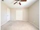 Neutral bedroom featuring a ceiling fan, closet and carpet at 1389 Rural Hall St, Deltona, FL 32725