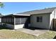 Exterior of home featuring screen patio and concrete patio at 1389 Rural Hall St, Deltona, FL 32725