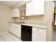 Kitchen area featuring white cabinets, granite counters and black appliances at 1389 Rural Hall St, Deltona, FL 32725