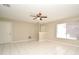 Spacious living room with tile flooring, neutral walls, and ample natural light at 1389 Rural Hall St, Deltona, FL 32725