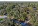 Aerial shot of the parcel on a wooded lot on a quiet street at 140 Sweet Bay Cir, Lake Mary, FL 32746