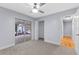 Well-lit bedroom featuring carpet flooring, a ceiling fan, and access to outdoor patio at 140 Sweet Bay Cir, Lake Mary, FL 32746