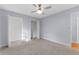 Spacious bedroom featuring a ceiling fan and a neutral color palette with plush carpeting at 140 Sweet Bay Cir, Lake Mary, FL 32746