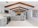 Well-appointed kitchen featuring gray cabinets, stainless appliances, and an exposed beam ceiling at 140 Sweet Bay Cir, Lake Mary, FL 32746