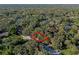 Aerial view of the area showing the boundaries of a wooded parcel, outlined in red at 140 Sweet Bay Cir, Lake Mary, FL 32746