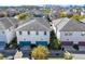 Aerial view of townhomes showing two-car garages and landscaping at 14137 Walcott Ave, Orlando, FL 32827