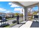 A balcony with black metal railings overlooks the street, providing an outdoor living space and neighborhood views at 14137 Walcott Ave, Orlando, FL 32827