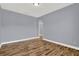 A spacious bedroom featuring wood-look flooring, neutral paint, and ample space for furniture arrangement at 14137 Walcott Ave, Orlando, FL 32827