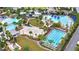 Gorgeous aerial view of the community pools, volleyball court, and clubhouse at 14137 Walcott Ave, Orlando, FL 32827