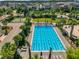 Aerial view of a pristine community lap pool and leisure areas in a residential neighborhood at 14137 Walcott Ave, Orlando, FL 32827