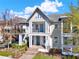 Charming two-story home featuring a double balcony, blue door, steps to entrance, and manicured front lawn at 14137 Walcott Ave, Orlando, FL 32827