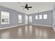 Bright living room with tile floors, neutral walls, ceiling fan, and ample natural light at 14137 Walcott Ave, Orlando, FL 32827