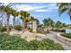 Community pool area featuring lounge chairs, hammocks, palm trees, and lush landscaping at 14137 Walcott Ave, Orlando, FL 32827