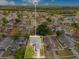 Aerial view showcases the property's location in a peaceful neighborhood near lush greenery at 150 Chicago Woods Cir, Orlando, FL 32824