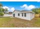 Spacious backyard featuring a well-maintained lawn, providing a private outdoor retreat at 150 Chicago Woods Cir, Orlando, FL 32824