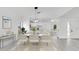Elegant dining area with stylish furniture, modern lighting, and an open floor plan, ideal for entertaining guests at 150 Chicago Woods Cir, Orlando, FL 32824