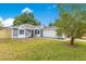 Charming single-story home featuring a well-manicured lawn and neutral tones, blending comfort with curb appeal at 150 Chicago Woods Cir, Orlando, FL 32824