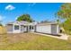 Charming single-story home with a gray painted brick accent and a well-manicured lawn at 150 Chicago Woods Cir, Orlando, FL 32824