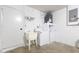 Functional laundry room equipped with a washer, dryer, and utility sink for convenience at 150 Chicago Woods Cir, Orlando, FL 32824