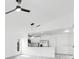 Bright, minimalist kitchen features stainless steel appliances and sleek finishes, seamlessly blending into a modern living space at 150 Chicago Woods Cir, Orlando, FL 32824