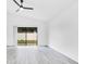 Bright living room with high ceilings and stylish flooring, creating an open and airy space at 150 Chicago Woods Cir, Orlando, FL 32824