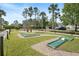 Community mini-golf course featuring well-maintained greens and mature trees at 155 Barefoot Beach Way, Kissimmee, FL 34746