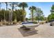 Outdoor ping pong table near a lake, offering a fun recreational activity with scenic views for residents at 155 Barefoot Beach Way, Kissimmee, FL 34746