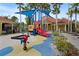 Colorful playground with slides and play equipment offers a safe and fun environment for children at 155 Barefoot Beach Way, Kissimmee, FL 34746