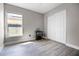 Bedroom with gray wood-look floors, closet and neutral paint at 1613 N Lakewood Ave, Ocoee, FL 34761