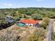 Aerial view of estate showcasing the pool, the home, and lush surrounding greenery at 17572 Davenport Rd, Winter Garden, FL 34787