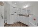 Bathroom featuring a glass-enclosed shower, white cabinetry, and dark granite countertops at 17572 Davenport Rd, Winter Garden, FL 34787