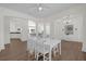 Dining room featuring hardwood floors with views of the living room and kitchen at 17572 Davenport Rd, Winter Garden, FL 34787