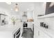 Bright kitchen boasting modern appliances, an island and sleek countertops at 1855 Cloverlawn Ave, Orlando, FL 32806