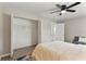 Calm bedroom with a ceiling fan, a spacious closet, and comfortable furnishings at 1920 E Edgewood Dr # A5, Lakeland, FL 33803