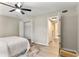 Bedroom featuring a ceiling fan, neutral walls, wood-look floors, and a closet at 1920 E Edgewood Dr # A5, Lakeland, FL 33803