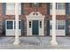 Brick building with a decorated entrance and white pillar accents at 1920 E Edgewood Dr # A5, Lakeland, FL 33803