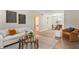 Spacious living room with modern decor, light wood floors, and ample natural light throughout at 1920 E Edgewood Dr # A5, Lakeland, FL 33803